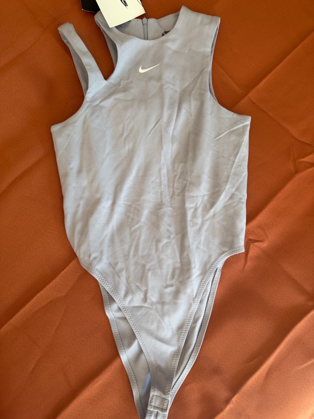 Nike Light Blue High-Cut Sleeveless Bodysuit with White Swoosh
